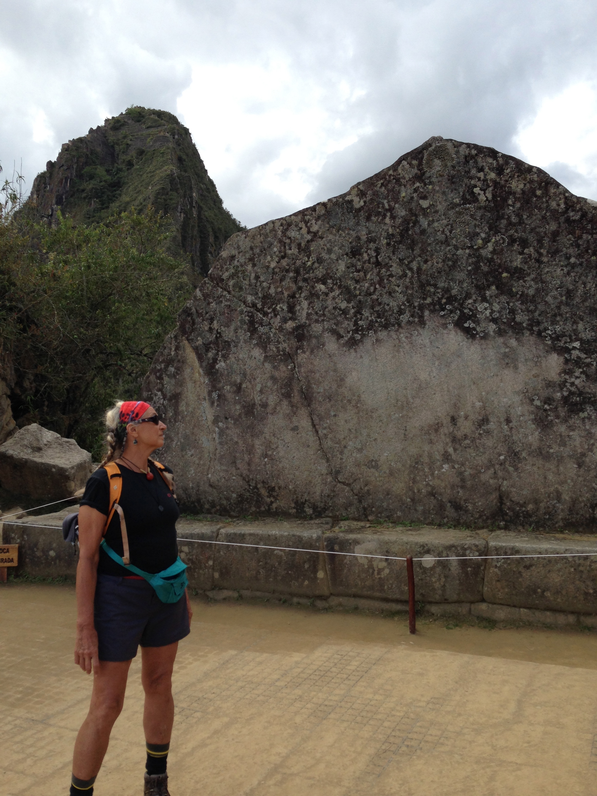 LordFlea standing before the Sacred Rock of Matchupicchu, honoring Juanapicchu, in background